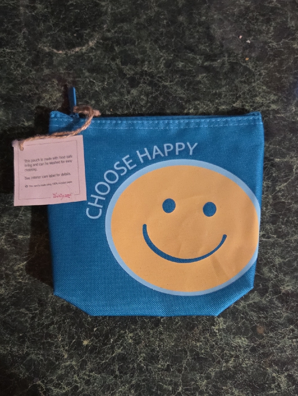 thirty-one turquoise pouch with yellow smile graphic